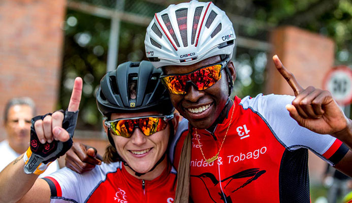 TT's Teneil Campbell, right, 2018 CAC Games road race champion, celebrates with compatriot Alexi Costa yesterday in Colombia.