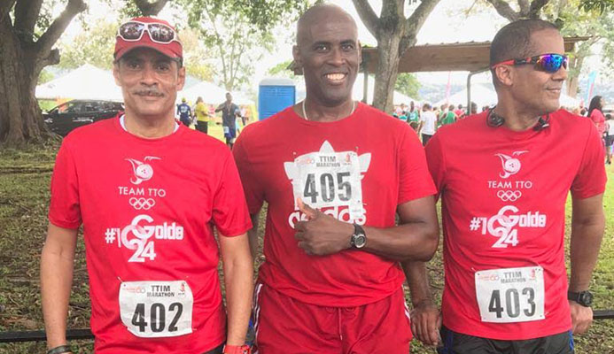Walking in support of the T&T Olympic Committee fundraising project during last Sunday’s T&T International Marathion were sports commentator and writer Andre Errol Baptiste, Olympic shooter Roger Daniel and sports enthausaist Nigel Mark Baptiste.