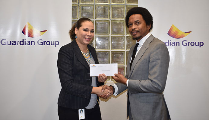 TTOC president Brian Lewis , right, collects a cheque from Ayesha Boucaud-Claxton, Guardian Group’s senior manager, group corporate communications, to aid the TTOC's #10golds24 athlete welfare and preparation fund recently.