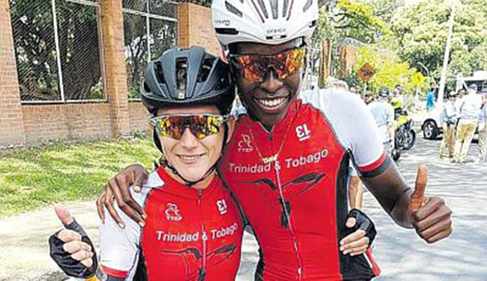 T&T’s women cyclists, golden girl Teneil Campbell, right, and compatriot Alexi Acosta following yesterday’s Points Race event at the CAC Games in Colombia.