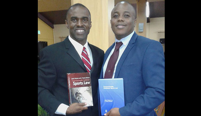 Tyrone Marcus (left) and Jason Haynes, after Tuesday's book launch at St Augustine.