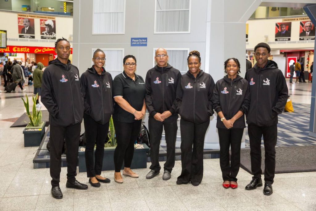 Athletes and officials of the NGC NAAA youth elite programme at the Piarco International Airport last year before the team left to attend the Michael Johnson Performance Unit in Texas for advanced athlete assessments and training. - 
