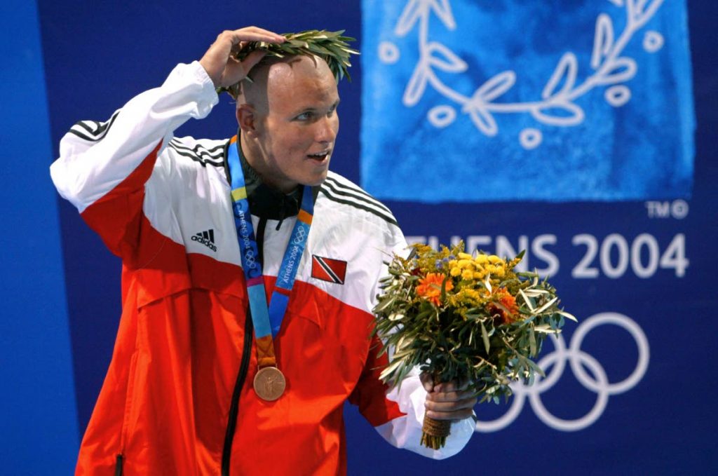 In this Aug 19,2004 file photo, TT’s George Bovell adjusts his crown after winning the men’s 200m individual medley bronze medal, at the 2004 Olympic Games at the Olympic Aquatic Center in Athens. AFP PHOTO -