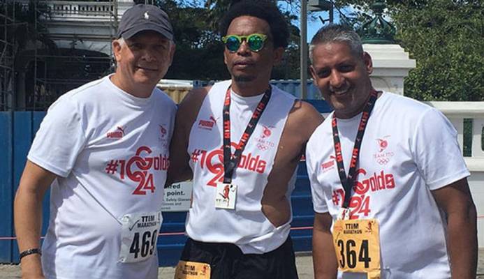 TTOC president Brian Lewis, centre, is flanked by Agriculture Minister Clarence Rambharat,left, and Mayor of Port of Spain Joel Martinez after they completed the TT International Marathon, last year. Lewis and Minister Rambharat are registered to participate in tomorrow’s marathon walk from 3.30 am.  courtesy TTOC