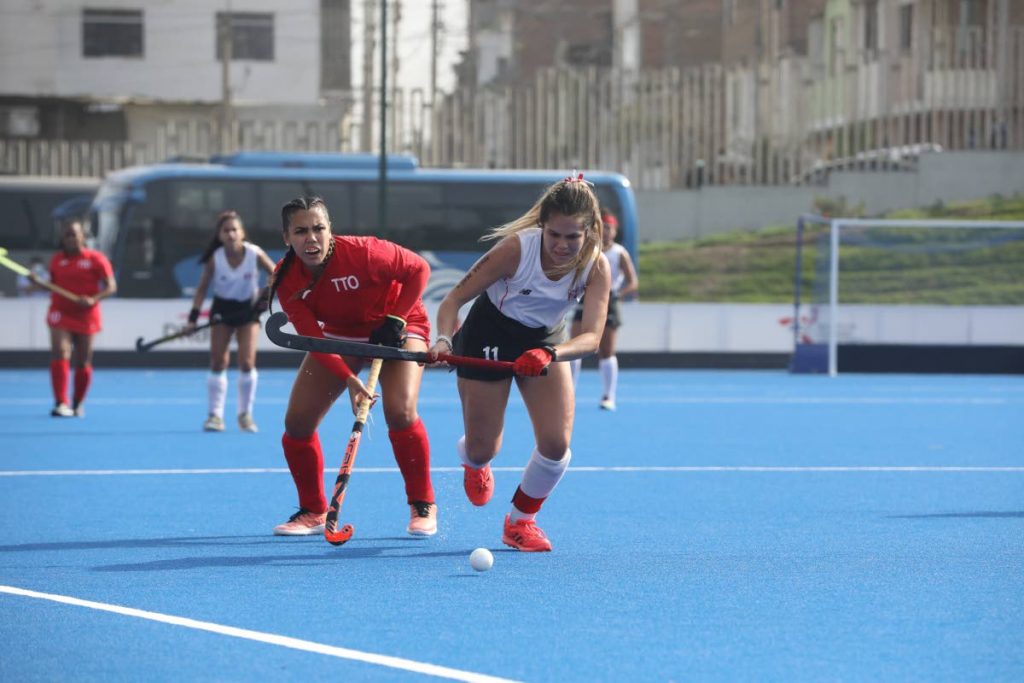 In this photo taken on Oct 2, Trinidad and Tobago’s Brianna Govia (second from right) and Peru’s captain Camila Mendez chase after the ball during their teams’ final of the Pan Am Challenge at Lima, Peru. -