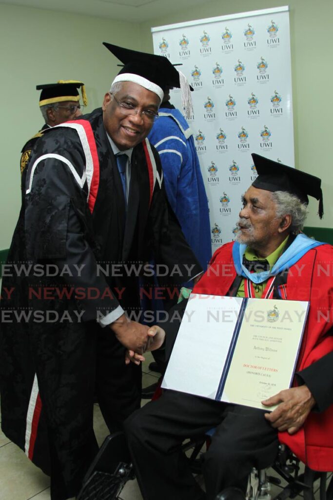 Tony 'Muffman' Williams, right, is congratulated by Prof Brian Copeland on his honorary doctor of letters degree from UWI at a graduation ceremony in October 2016. - FILE PHOTO