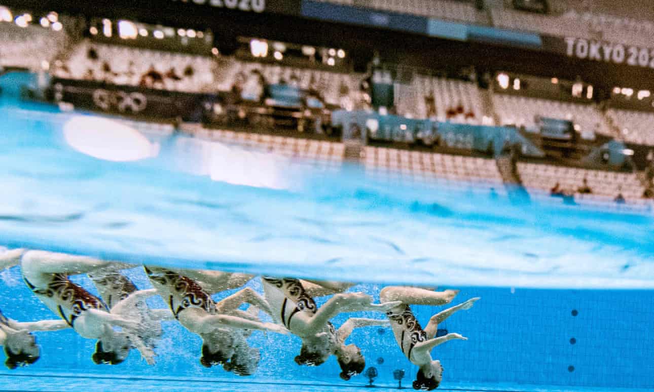 The Canada synchronised swimming team perform at a near-empty Tokyo Aquatics Centre. Photograph: François-Xavier Marit/AFP/Getty Images