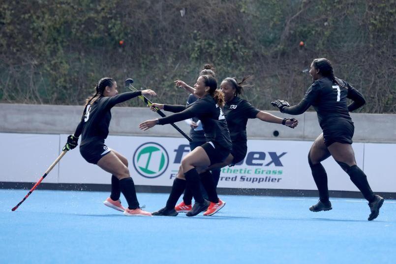 FLASHBACK: File photo shows Trinidad and Tobago’s Brianna Govia, left, and Shaniah de, celebrating with their team-mates during their win over Paraguay in the Women’s Pan American Challenge in Lima, Peru, last October. —Photo courtesy Pan Am Hockey