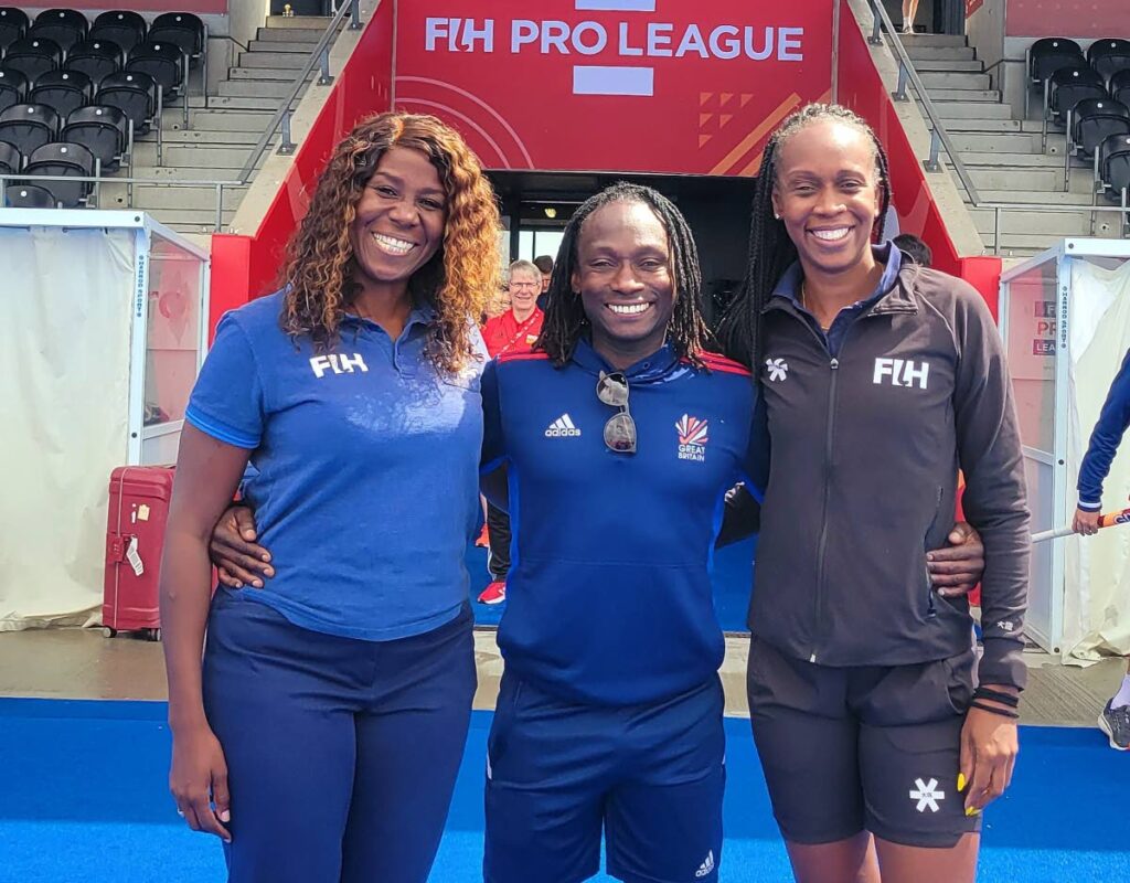 Hockey coach Kwandwayne Browne, centre, with officials Ayanna McClean, right, and Reyah Richardson, at the FIH Pro League in London, England recently. - (Image obtained at newsday.co.tt)