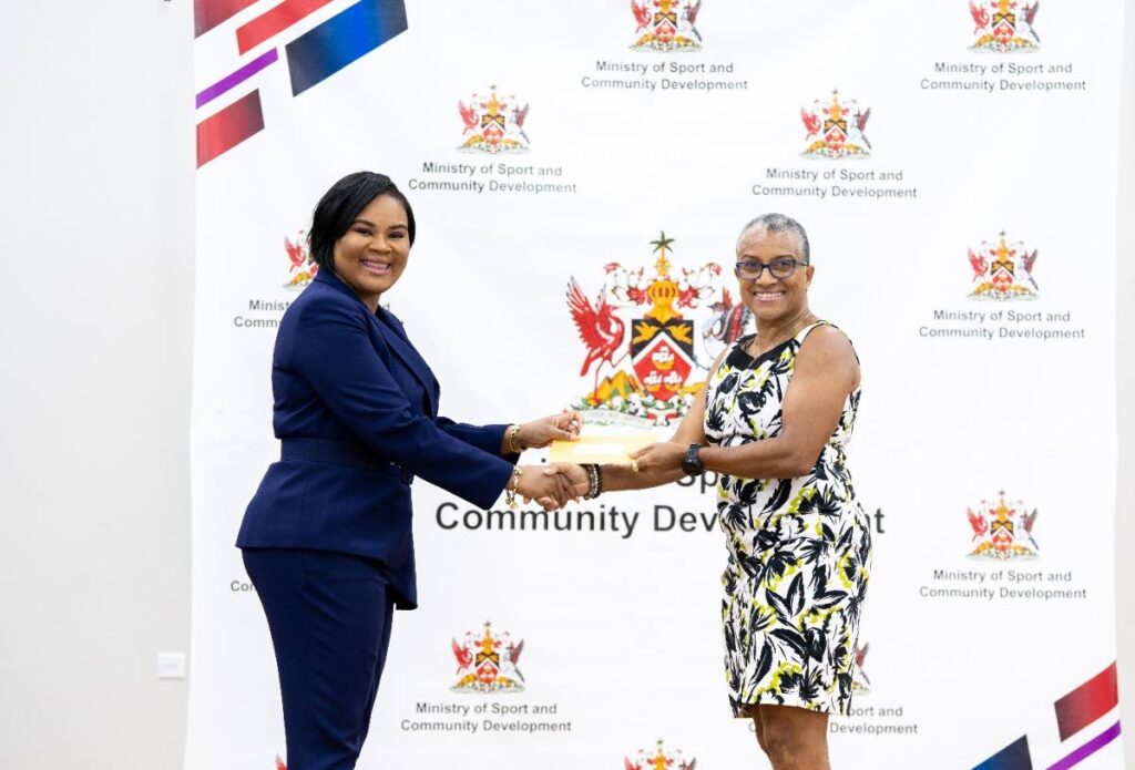 HANDOVER: Sport and Community Development Minister Shamfa Cudjoe, left, presents TTOC president Dianne Henderson with a cheque at the Belmont Community Centre. PHOTO COURTESY SPORT MINISTRY - (Image obtained at newsday.co.tt)