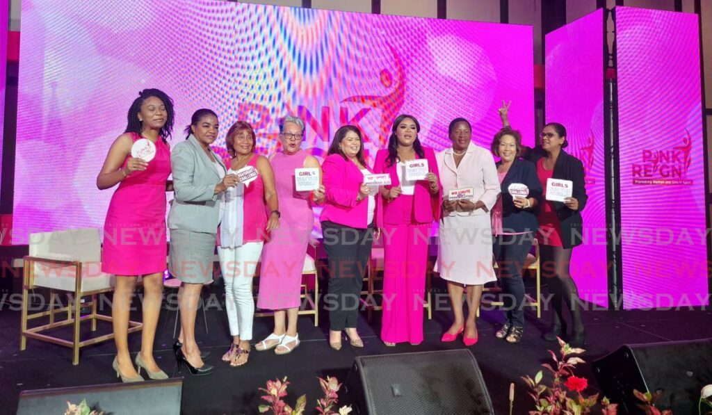 Minister of Sport and Community Development, Shamfa Cudjoe-Lewis (fourth from right) and Minister of Planning and Development, Penelope Beckles (third from right), with Team Poon members at the launch of Pink Reign 2024 at the Hilton Trinidad and Conference Centre on Wednesday. - Roneil Walcott (Image obtained at newsday.co.tt)